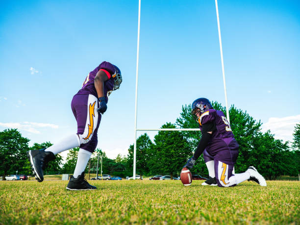 istock Junior Football players during game 1253891119