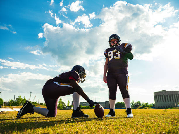 istock Junior Football players during game 1253891422