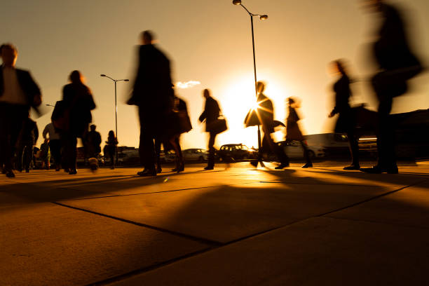 istock Office Workers Walking Fast in Sun Rays, Blurred Motion, London, United Kingdom 1253891473