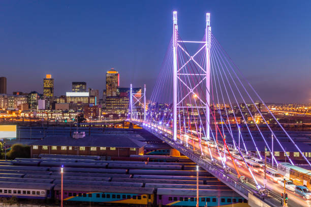 Nelson Mandela Bridge in Johannesburg, South Africa Nelson Mandela Bridge in Johannesburg, South Africa, seen lit up in the evening with moving traffic, Johannesburg is also known as Jozi, Jo'burg or eGoli, is the largest city in South Africa. johannesburg photos stock pictures, royalty-free photos & images