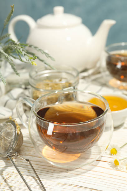 istock Composition with chamomile tea on white wooden table 1253893543