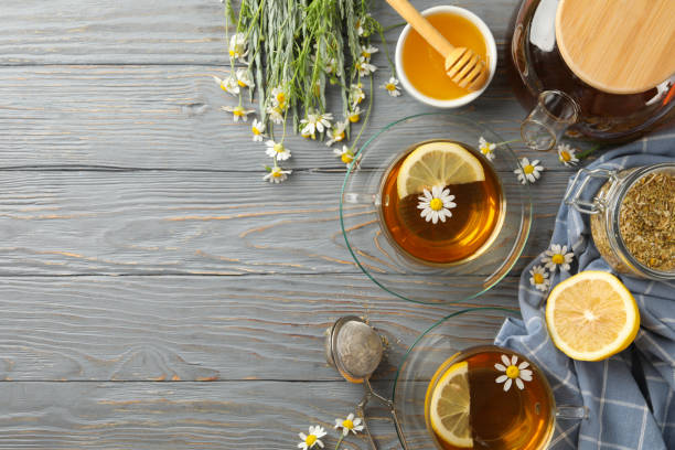 istock Composition with chamomile tea on gray wooden background 1253893611