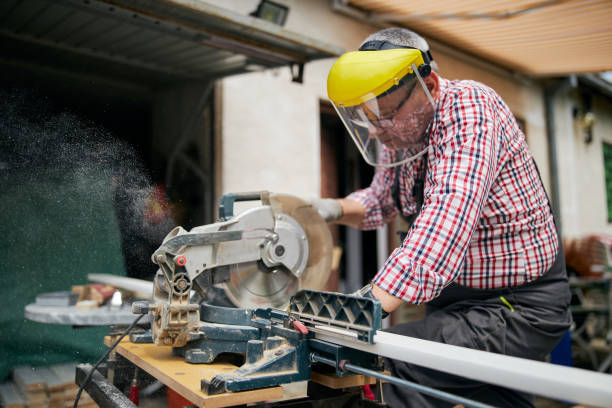 istock Skilled senior carpenter cutting with an electric saw 1253893925