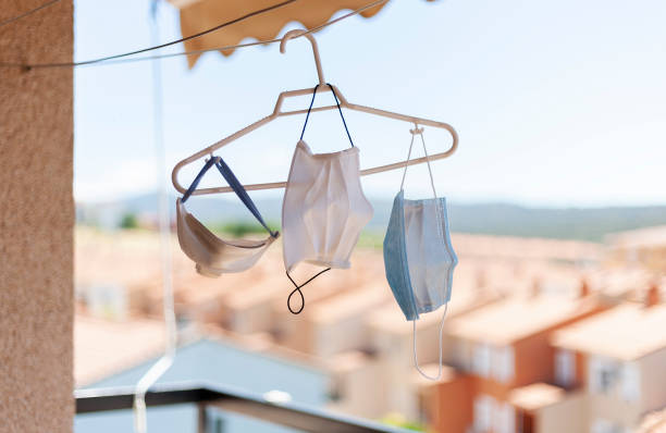 istock Various types of coronavirus face masks hung to ventilate. 1253893959