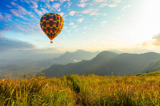 istock Hot air balloons with landscape mountain 1253894335