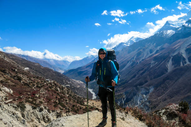istock Tilicho Base Camp - A man enjoying the trek in Himalayas 1253894368