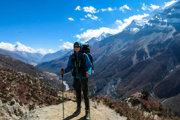 istock Tilicho Base Camp - A man enjoying the trek in Himalayas 1253894432