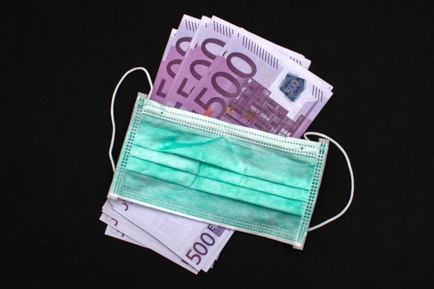 istock medical mask with 500 euro bills 1253894444