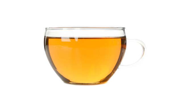 istock Glass cup of chamomile tea isolated on white background 1253895235