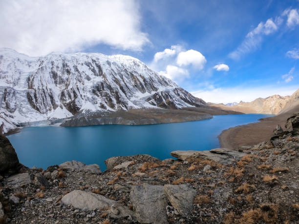 istock Tilicho Lake - A panoramic view on turquoise colored lake in Himalayas 1253895702