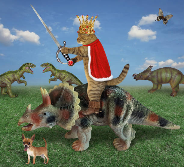 istock Cat king with sword riding triceratops 2 1253897706