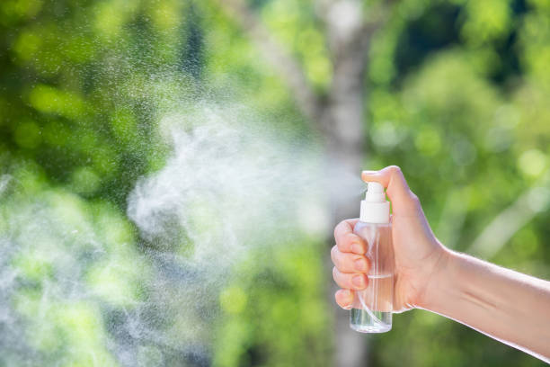 istock Hand sprays means with a spray . 1253897940