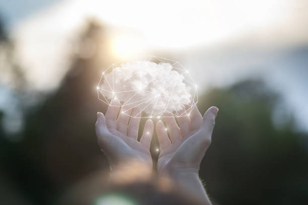 istock Hands show a brain consisting of clouds . 1253897943
