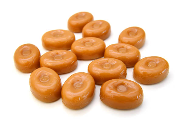 Caramel candies isolated on white background
