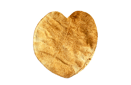 Famous traditional Arabic pita bread in a heart shape isolated on white background. Top view. Flatbread.