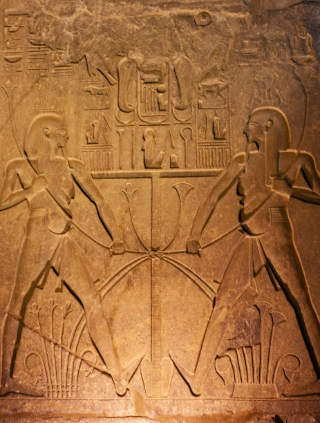 istock Hieroglyphic carvings on wall at Luxor Temple during night 1253898917