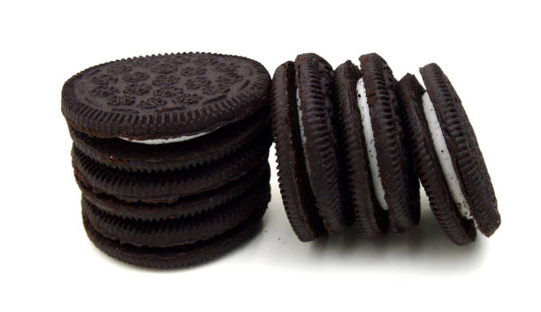 istock Sandwich cookies with cream on white background 1253899032