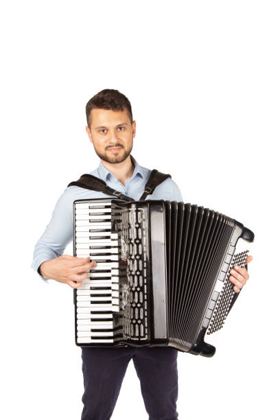 istock Young man playing accordion 1253900073