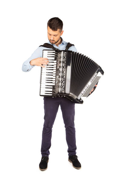 istock Young man playing accordion 1253900087