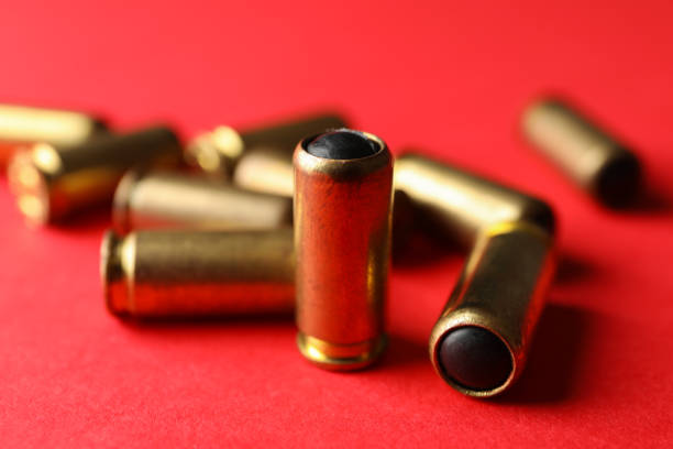 Rubber bullets on red background, close up