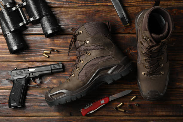 istock Military accessories on wooden background, top view 1253900972