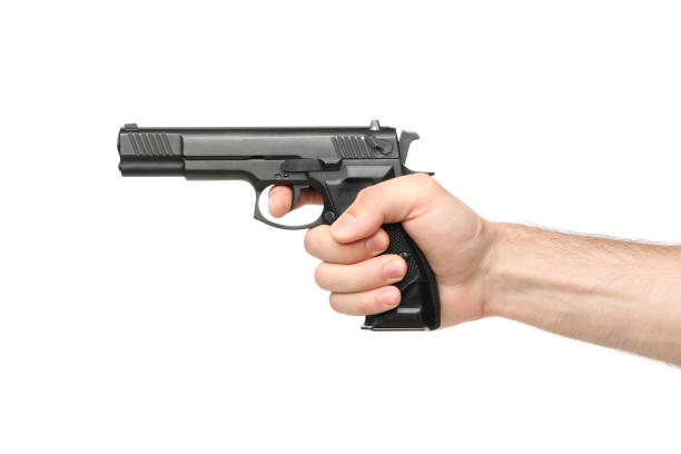 istock Male hand hold black pistol, isolated on white background 1253901297