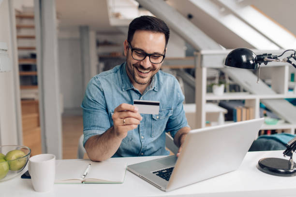 istock Young businessman shopping online 1253904383