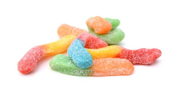 istock Gummy worm candies on white background 1253905350