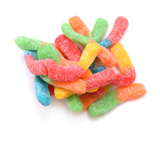 istock Gummy worm candies on white background 1253905432