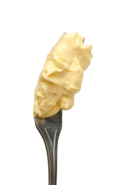 istock Pieces of butter isolated on white background, top view - Image 1253905748