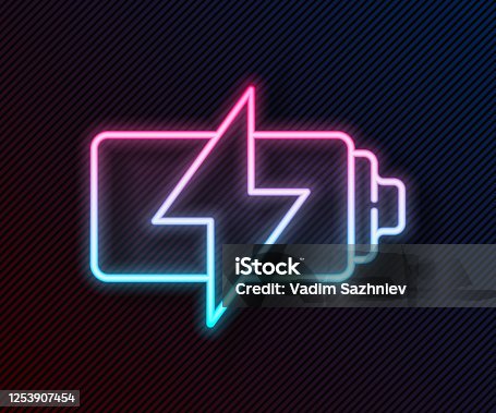 istock Glowing neon line Battery icon isolated on black background. Lightning bolt symbol. Vector Illustration 1253907454
