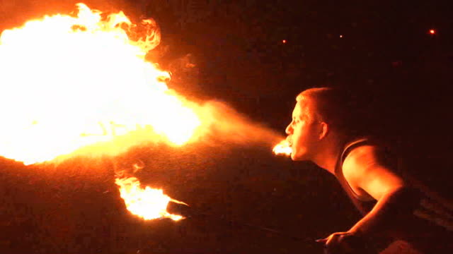 Fire Breather / Breathing Performer blow flames from mouth