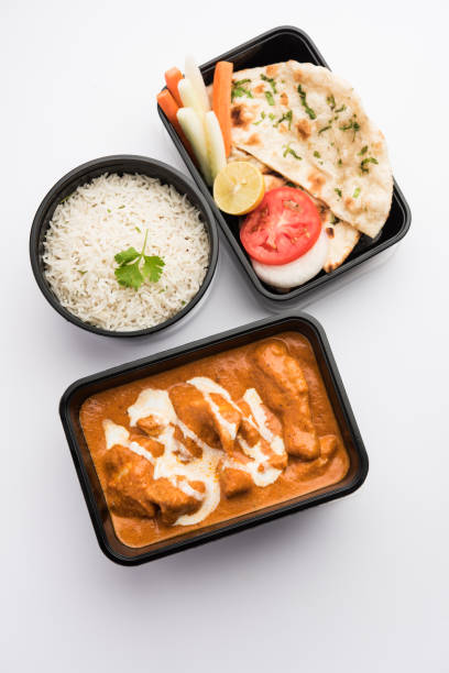 istock Butter chicken in black plastic container, ready for home delivery 1253908648