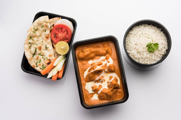 istock Butter chicken in black plastic container, ready for home delivery 1253908852