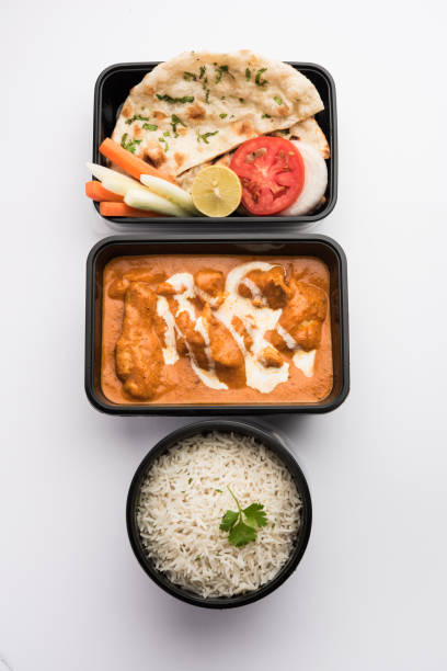 istock Butter chicken in black plastic container, ready for home delivery 1253909540