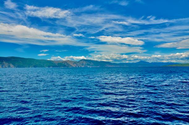 istock Sea scape with island on horizon 1253910591