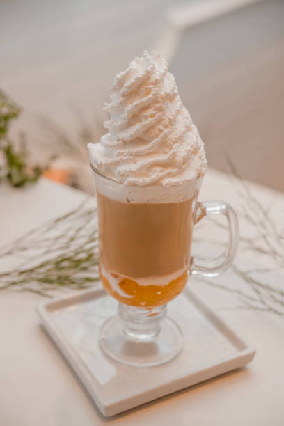 istock special coffee cup with cream and spices on light background, selective focus 1253910647