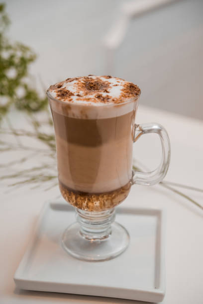 istock special coffee cup with cream and spices on light background, selective focus 1253910780