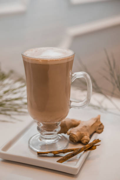 istock special coffee cup with cream and spices on light background, selective focus 1253910784
