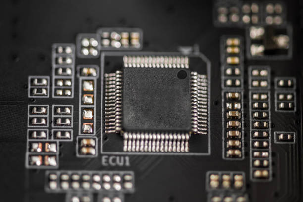 istock Computer components. PCB to PC. Chip, capacitor and connectors on the motherboard of a personal computer. Close up  circuit board of an electronic device. Modern technological background. 1253912210