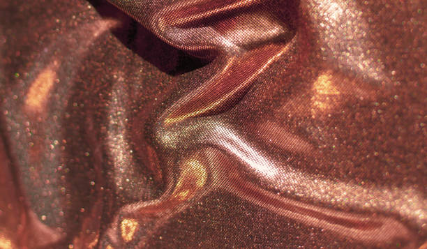 istock Texture of golden fabric waves 1253913390
