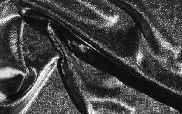 istock texture of silver fabric in waves 1253913433