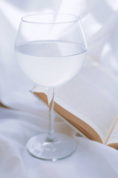 istock Glass of water and book 1253913532