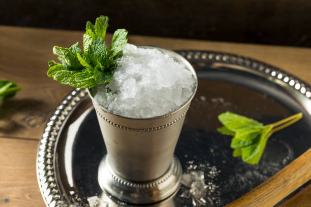 Frozen Boozy Bourbon Mint Julep Frozen Boozy Bourbon Mint Julep in a Glass glass of bourbon stock pictures, royalty-free photos & images