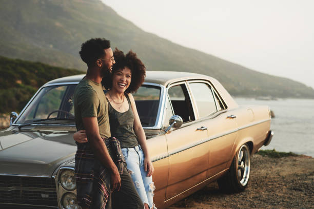 There's just something so pleasurable about a road trip Shot of a young couple stopping to look at the view during a road trip exclusive travel stock pictures, royalty-free photos & images