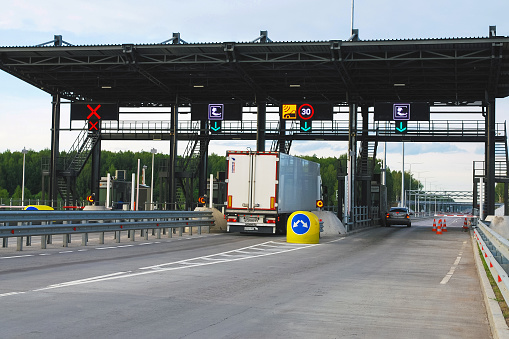 Moscow 25/06/2019 Pay point on toll road, truck and car paying fare at toll gate