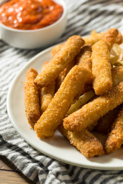 istock Homemade Deep Fried Fish Sticks and Fries 1253917409