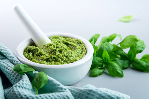 istock Homemade basil pesto on a gray table 1253918163