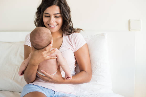 istock Mother holding newborn baby 1253918759