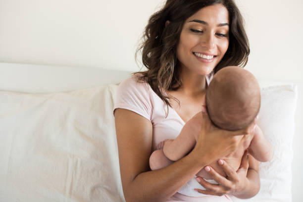 istock Mother holding newborn baby 1253918761